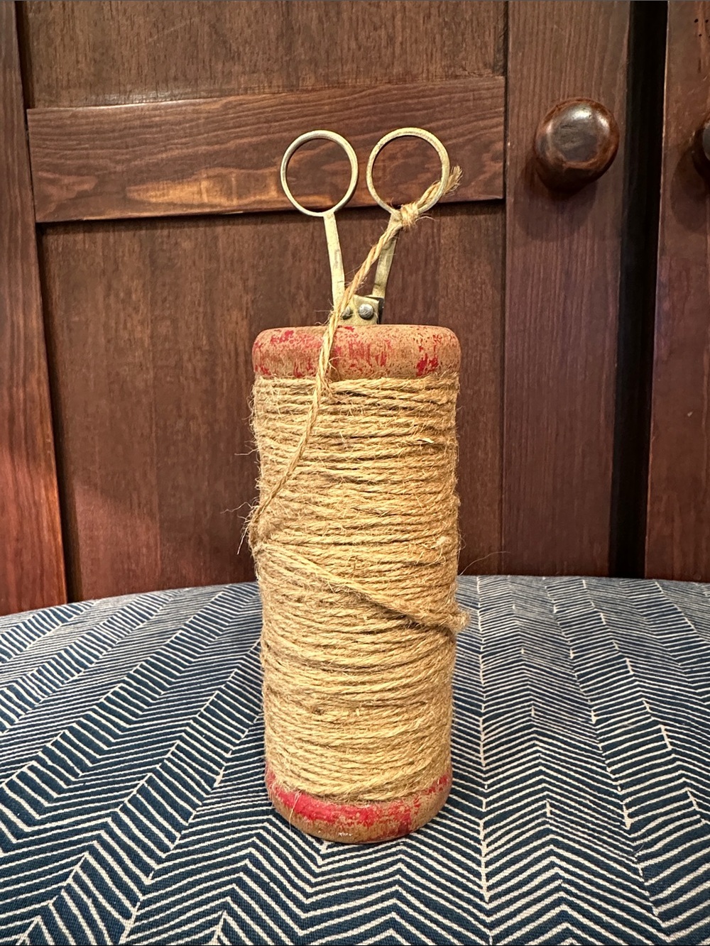 Vintage wooden spool with twine • scissors